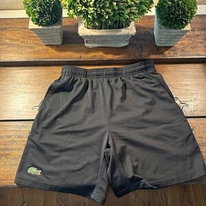 Men’s Lacoste workout shorts with pockets.